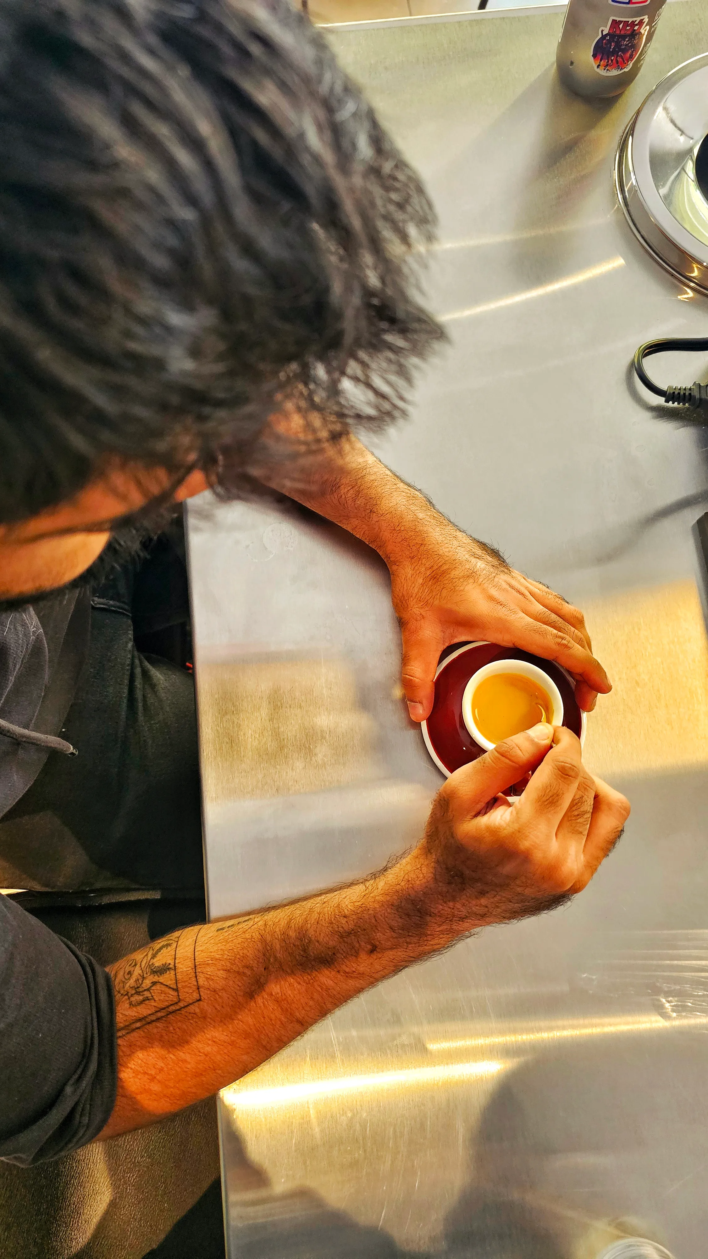 A shot of espresso being pulled at Juno Coffee Club