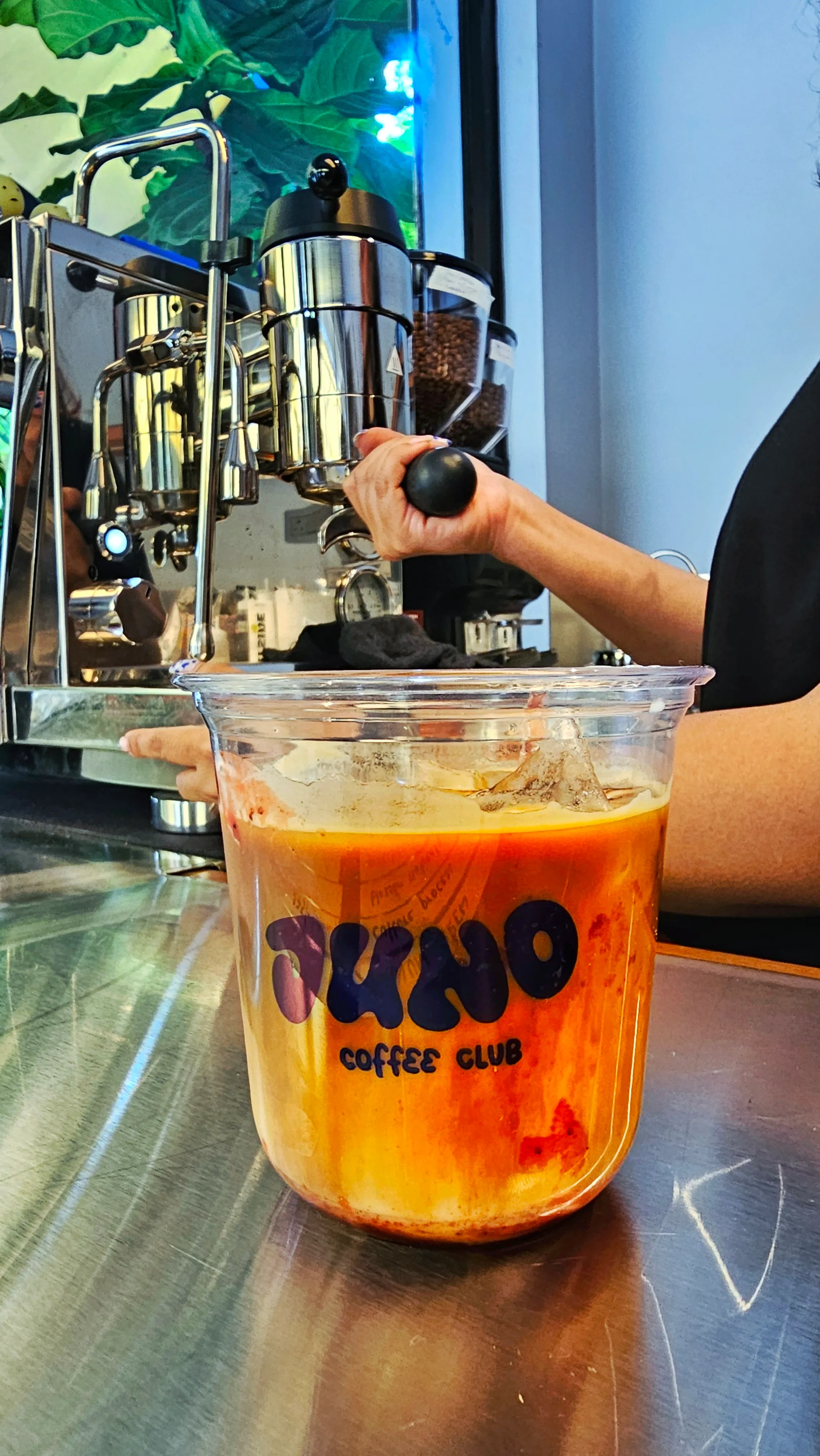A PBJ iced latte to go at Juno Coffee Club